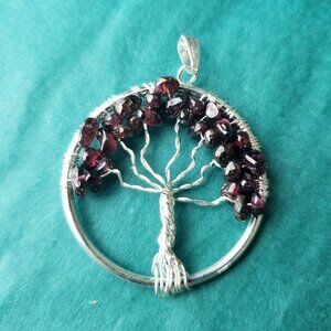 2/15$ garnet tree of life wire wrap pendant silver tone